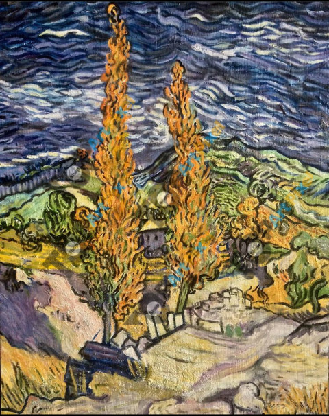 Dos Álamos con un fondo de montañas.